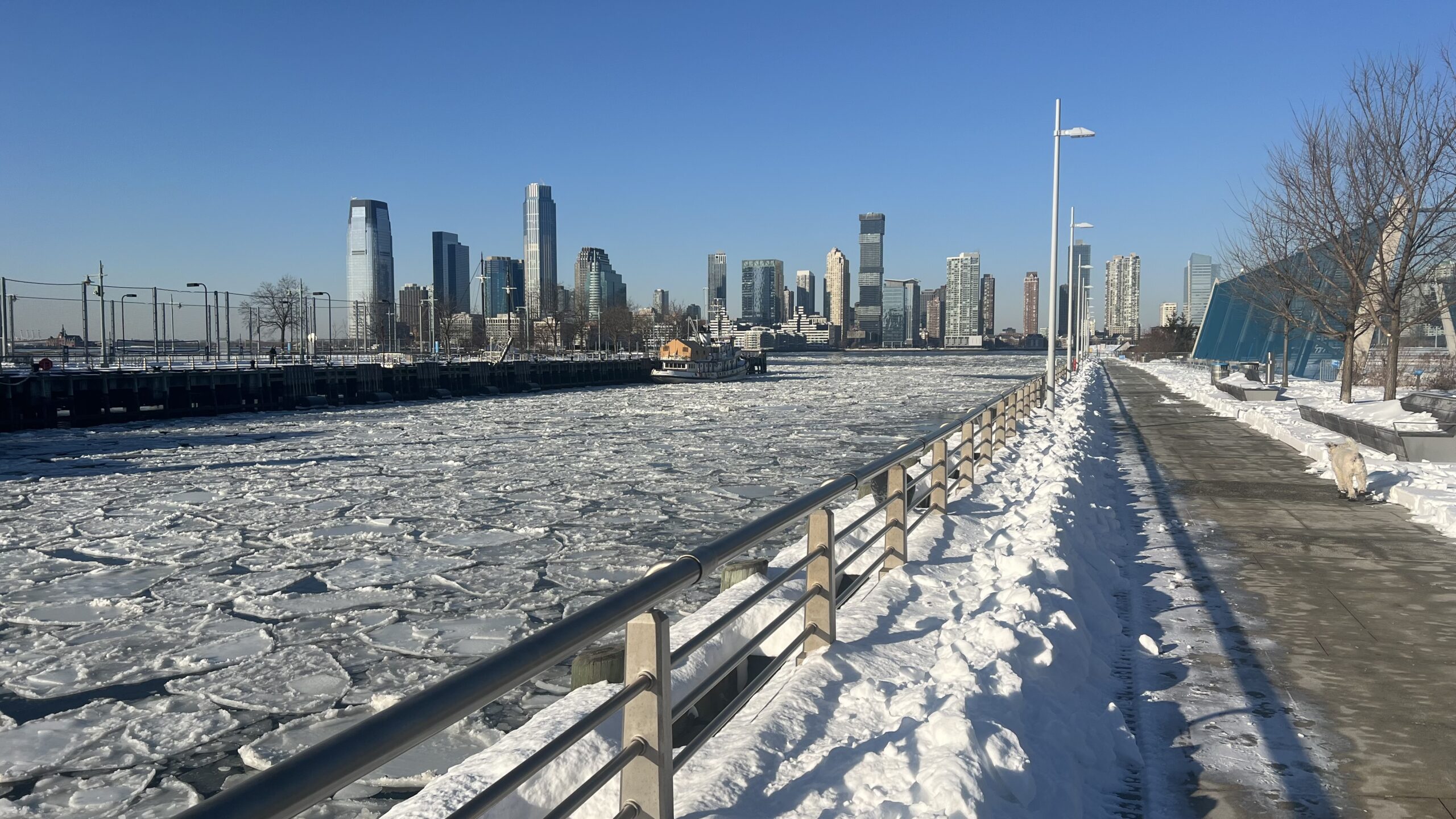 Ice floes on the Hudson River south of Pier 26, featuring snow and cleared path