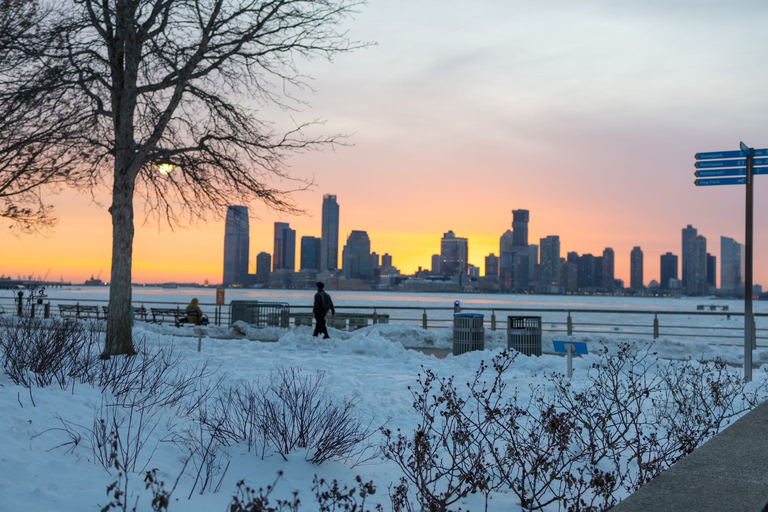 sunset over snowy scene in Tribeca in Hudson River Park