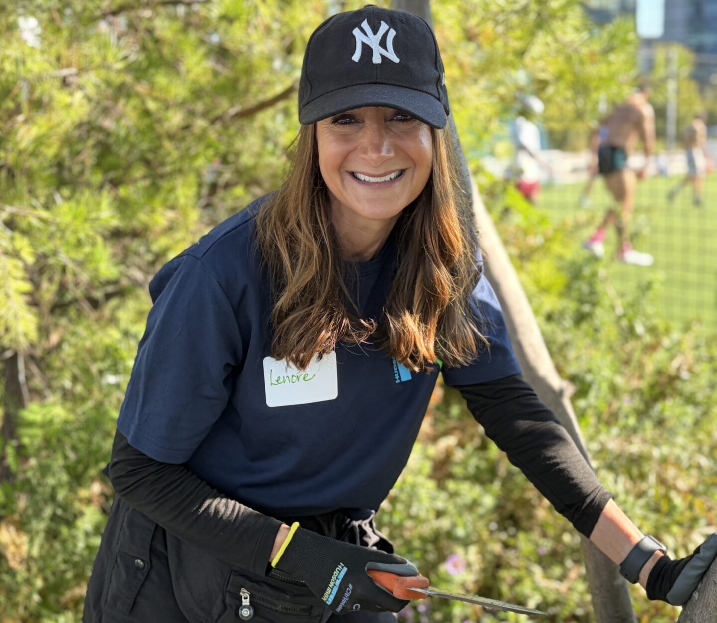 A volunteer smiling an looking at camera