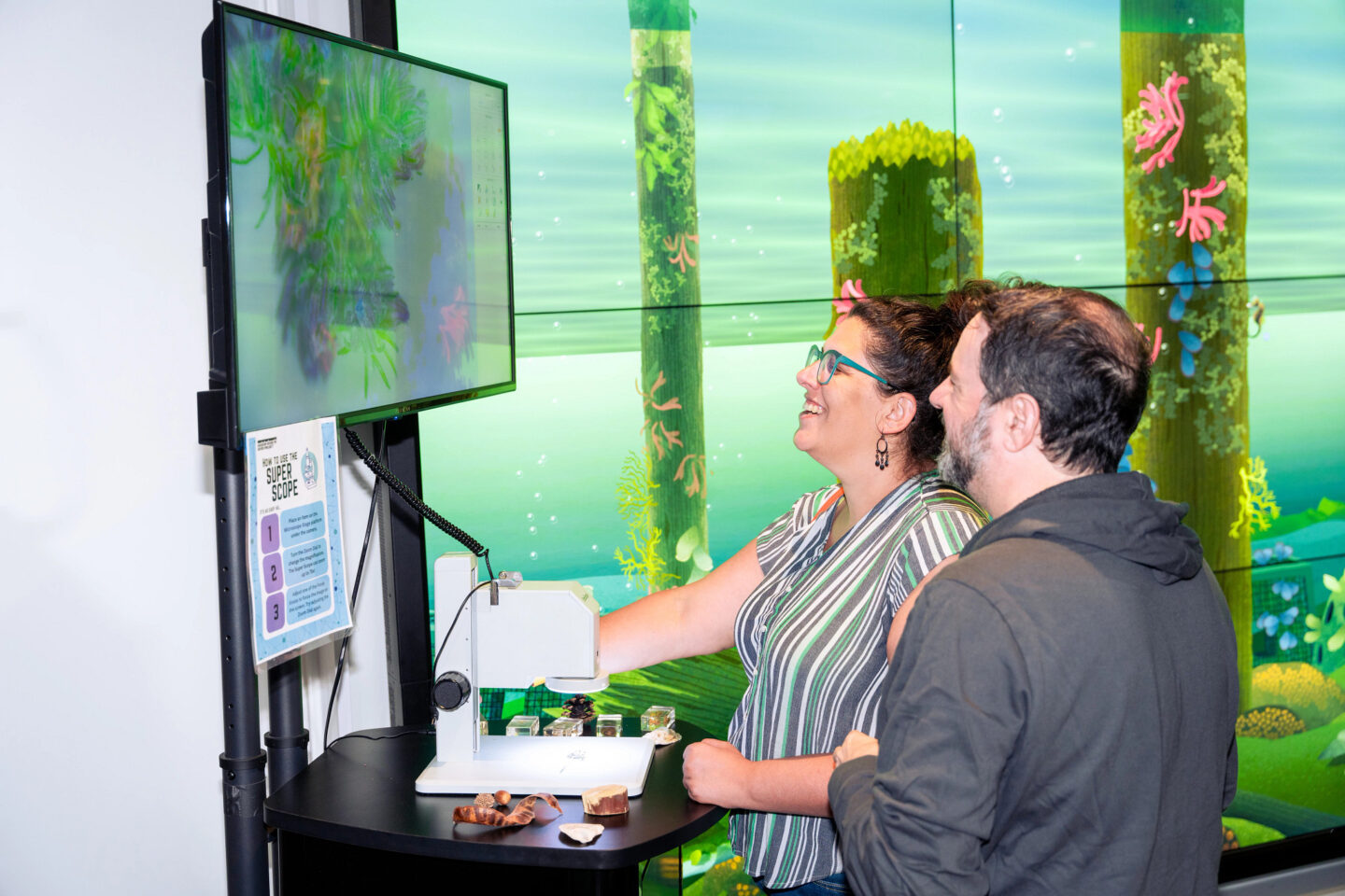 2 individuals looking at a screen