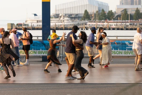 Pairs of people dancing together on the Blues Dance Floor at the Blues BBQ Festival