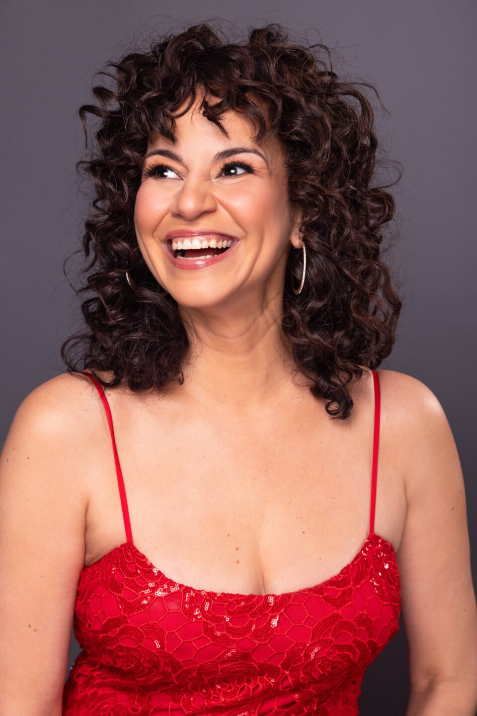 Professional headshot of Mandy Gonzalez