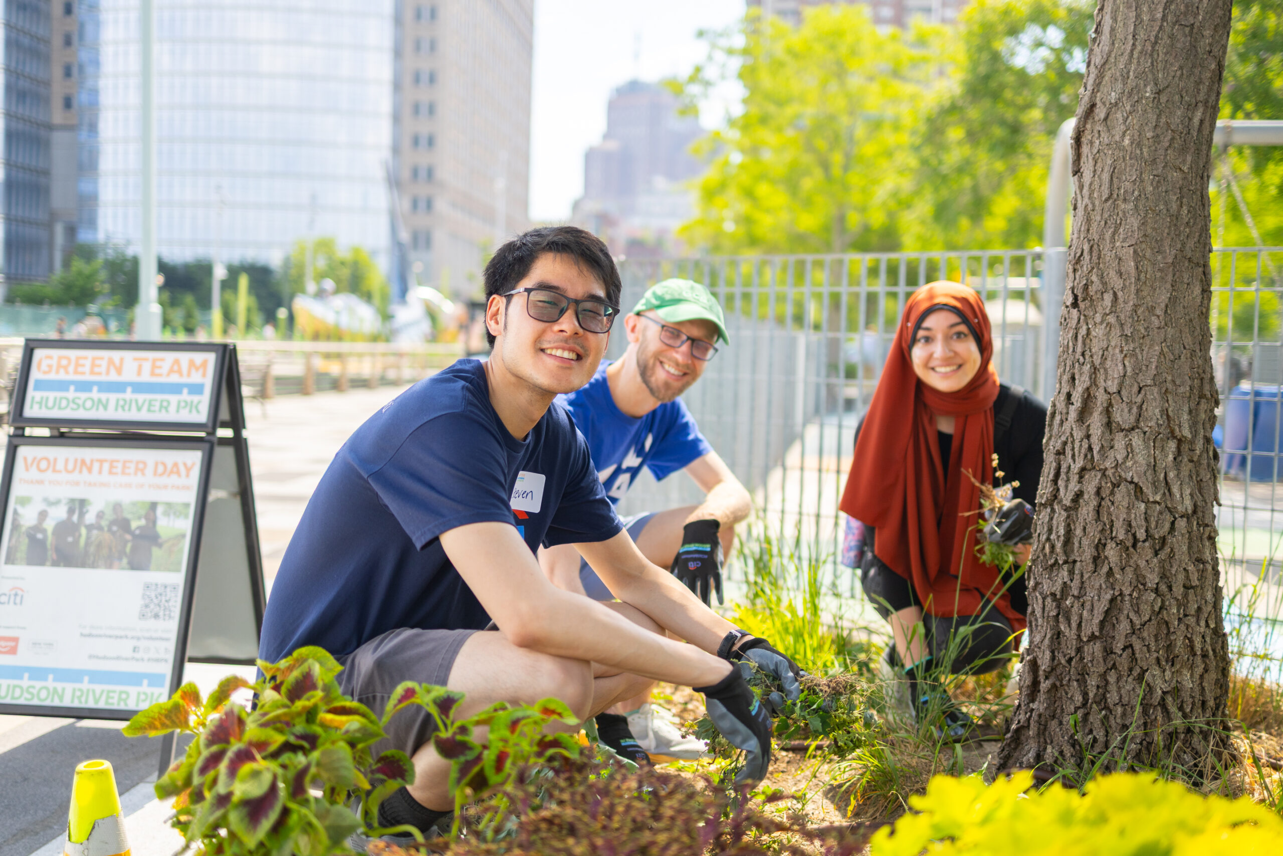 Volunteers gardening near tree at Citi Family Day 2026 in Hudson River Park