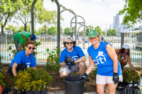 Three volunteers gardening at Citi Family Day 2026 in Hudson River Park