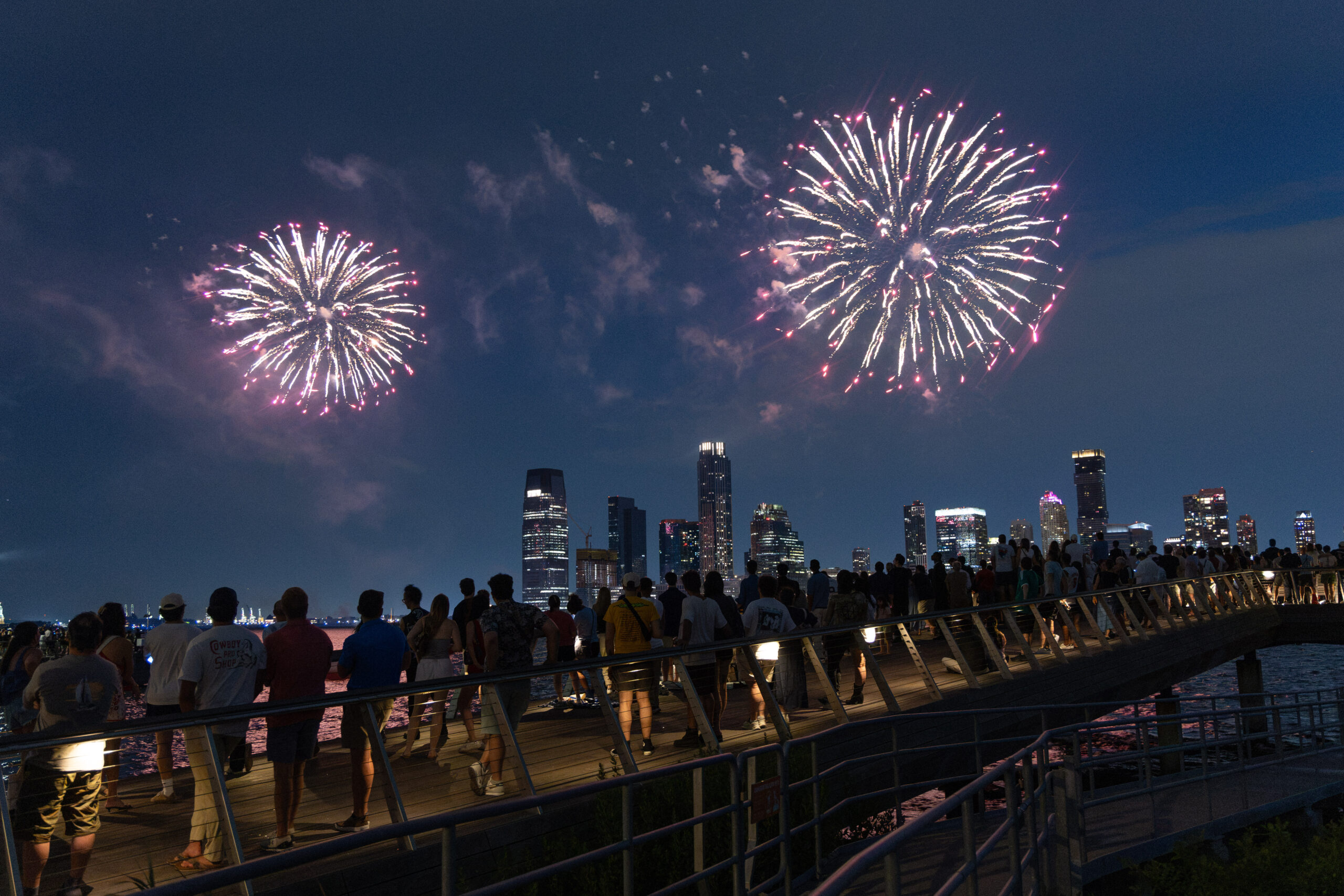 Crowds gather at edge of Pier 26 to watch fireworks display over Hudson River
