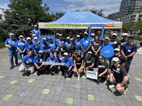 Citi volunteers gathered in front of Hudson River Park tent