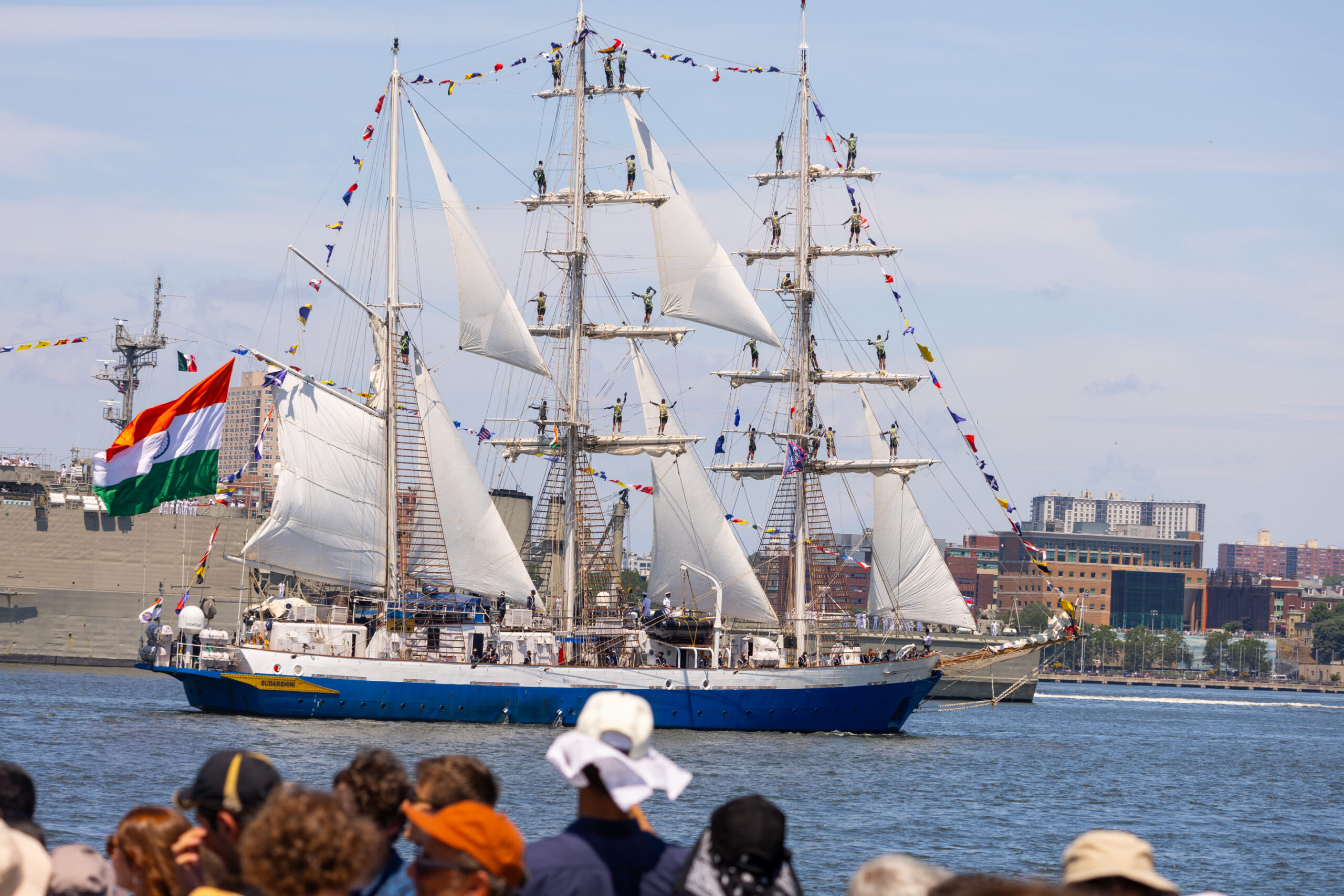 Tall ship sails by crowd at Hudson River Park